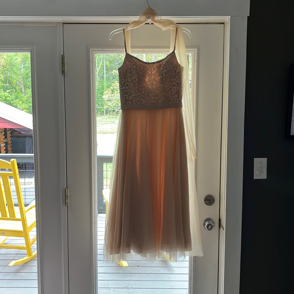 Gold dress with sequin accent top and tulle skirt.